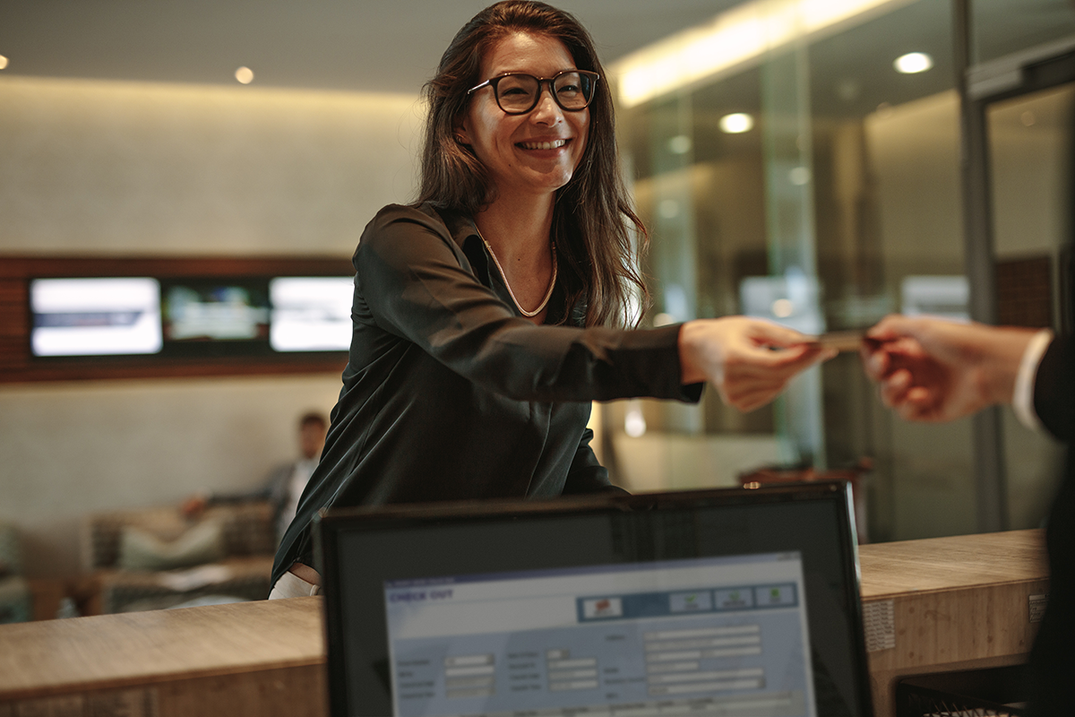 Business woman paying using her credit card